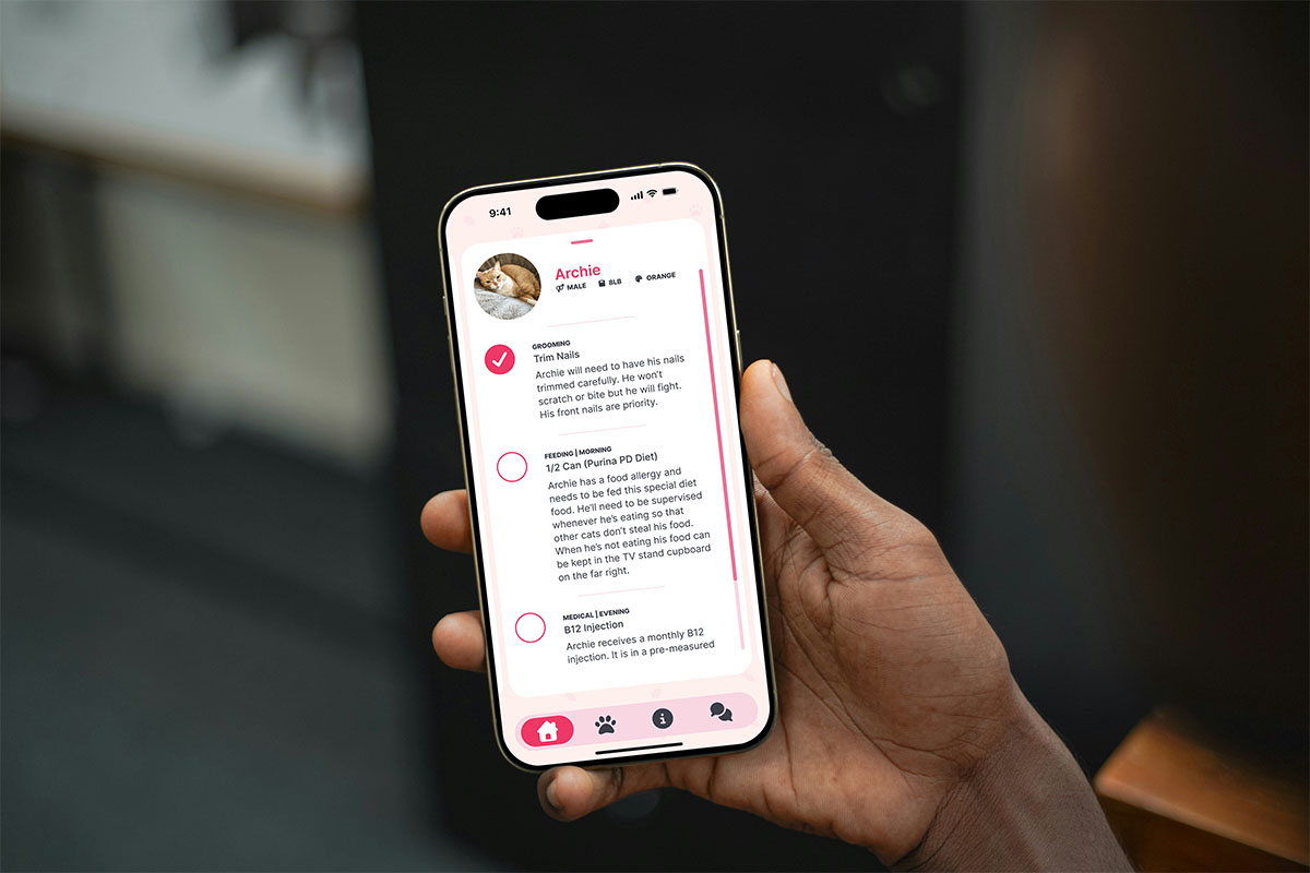 Person holding iphone with app open.