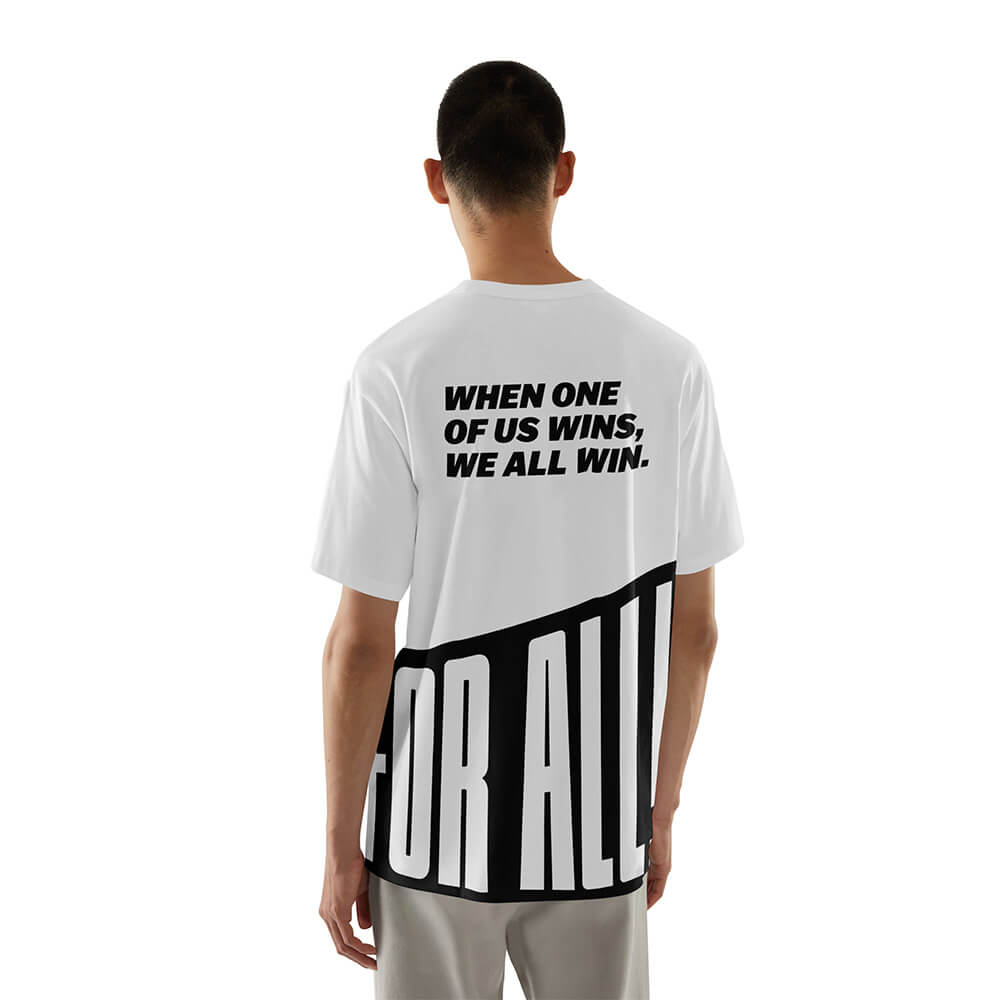 mockup of a man facing away from the camera with a white tshirt and black text that says 'When one of us wins, we all win' and the For All logo at the bottom of the shirt.